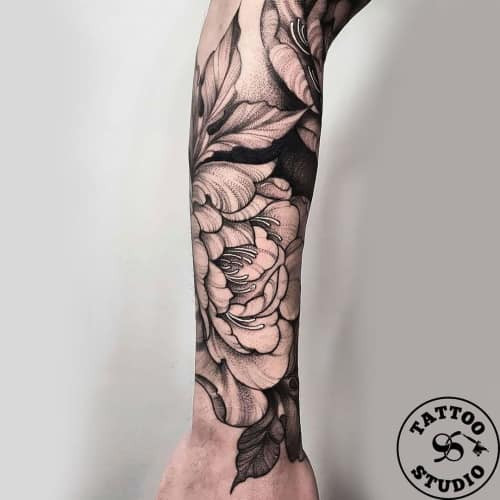 Detailed blackwork flower tattoo design for men, showcasing intricate shading and linework.