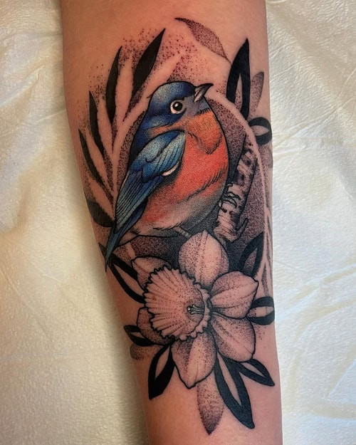 Joyful bluebird tattoo for men, representing happiness, positivity, and good fortune