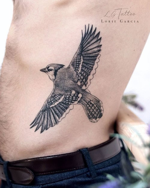Loyal blue jay bird tattoo for men, representing clarity of thought and family protection