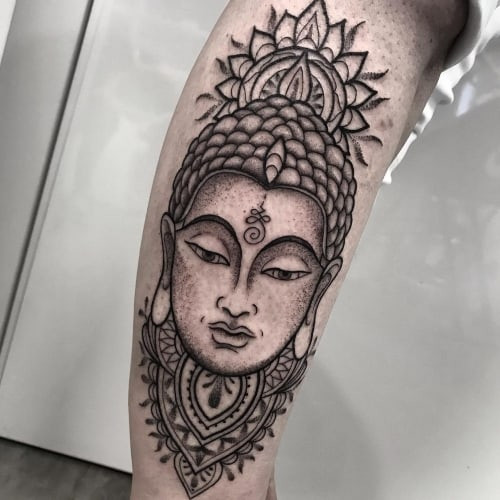 Geometric Buddha tattoo on the chest, combining spirituality and modern art in men tattoo ideas.