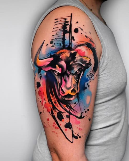 Full sleeve bull tattoo with various bull imagery and landscape elements