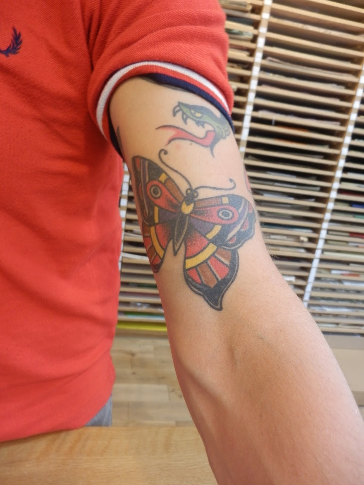Man with butterfly tattoo on arm