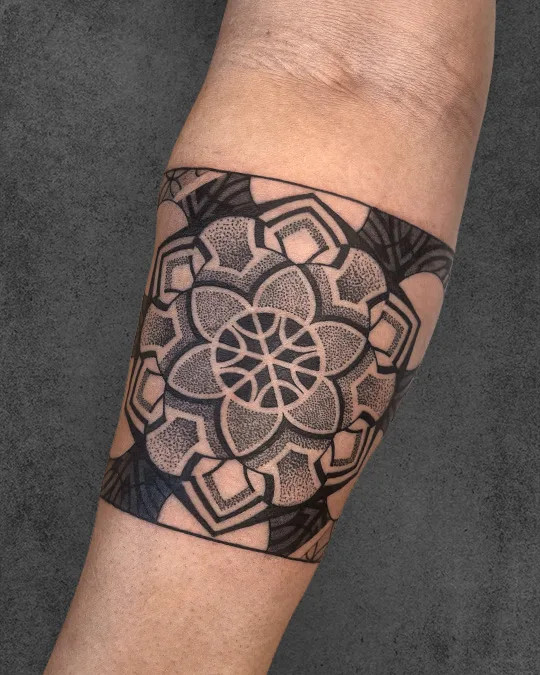 Detailed armband Flower of Life tattoo with shading and depth, creating a three-dimensional effect and enhancing its visual impact.