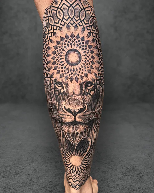 Dualism-themed tattoo featuring a lion and Flower of Life, symbolizing the balance between primal strength and spiritual interconnectedness.