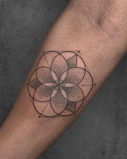 Minimalist and subtle Flower of Life tattoo, offering a discreet yet meaningful expression of sacred geometry on the skin.