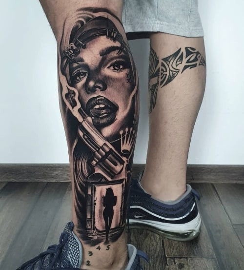 A calf tattoo with detailed shading on a man's lower leg, muscular placement