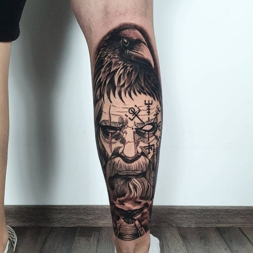 Calf tattoo with black and grey realism on a man's leg