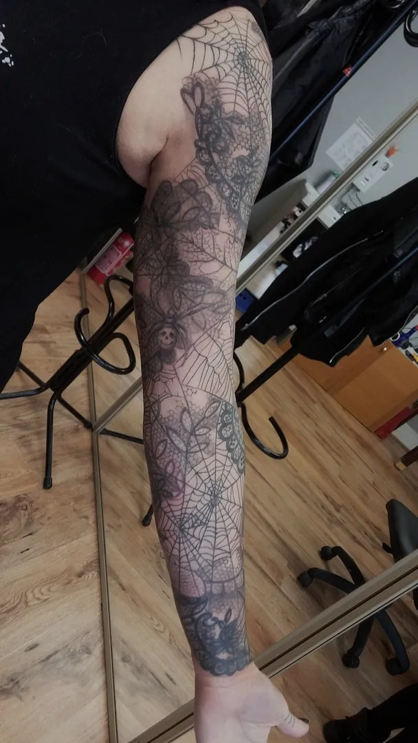 Another perspective of the cobweb tattoo sleeve showing the flow and composition of the design around the arm