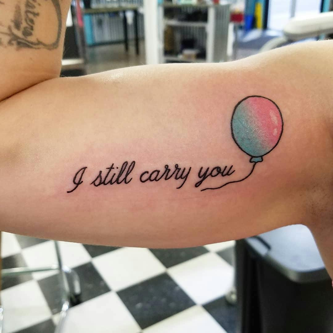 Carry you quote and drawing miscarriage tattoo on arm.