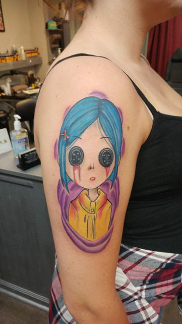 Full color vibrant tattoo of a stylized woman's face with geometric elements by Joe Dillon