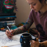 Cecilia Granata sketching tattoo designs