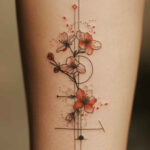 Elegant single cherry blossom branch tattoo on the forearm.