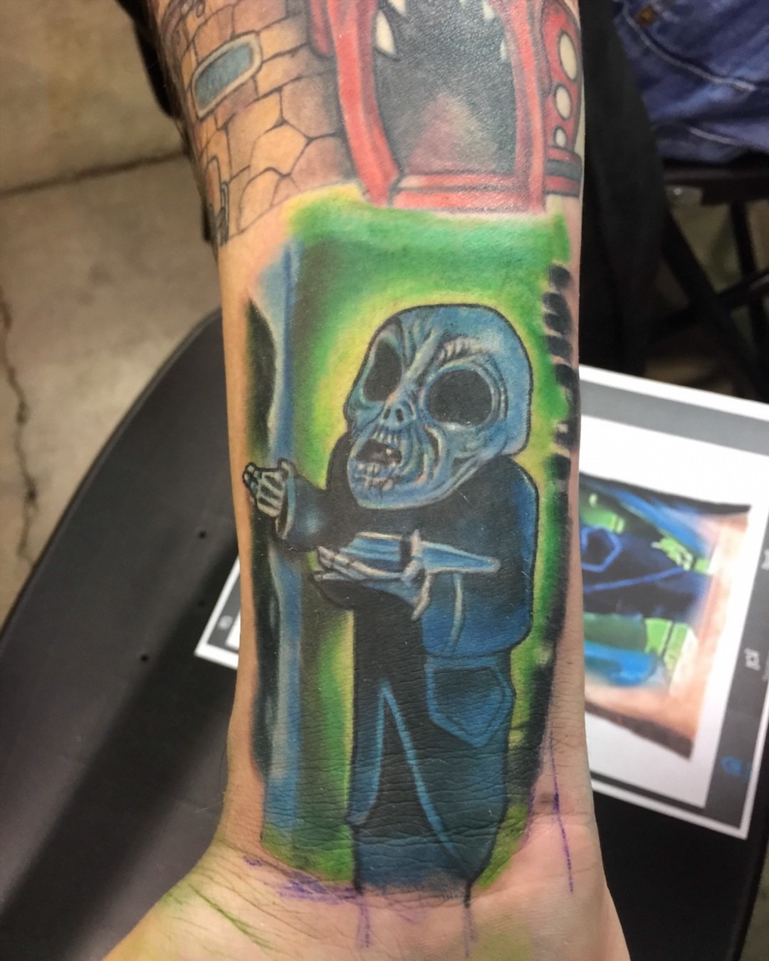 Neo Traditional Captain Spaulding skull tattoo on a calf, freshly inked at the Chicago Tattoo Convention