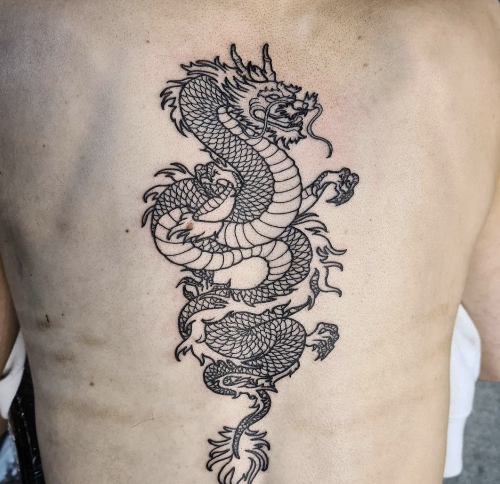 Detailed Chinese dragon tattoo art on shoulder