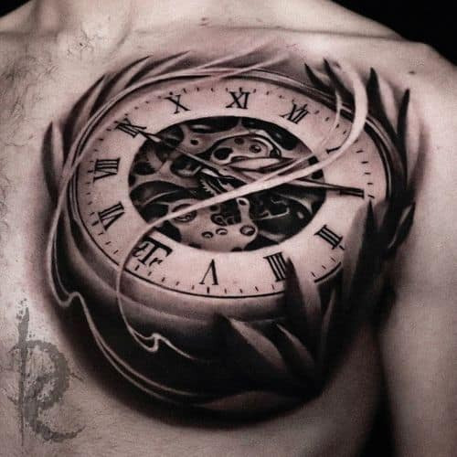 Intricate pocket watch tattoo with roses on a man's arm