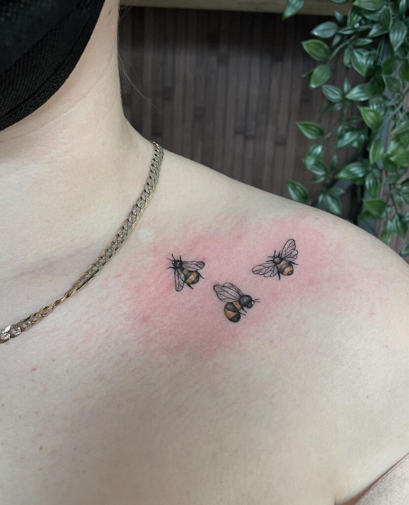 Matching collarbone adornments tattoo