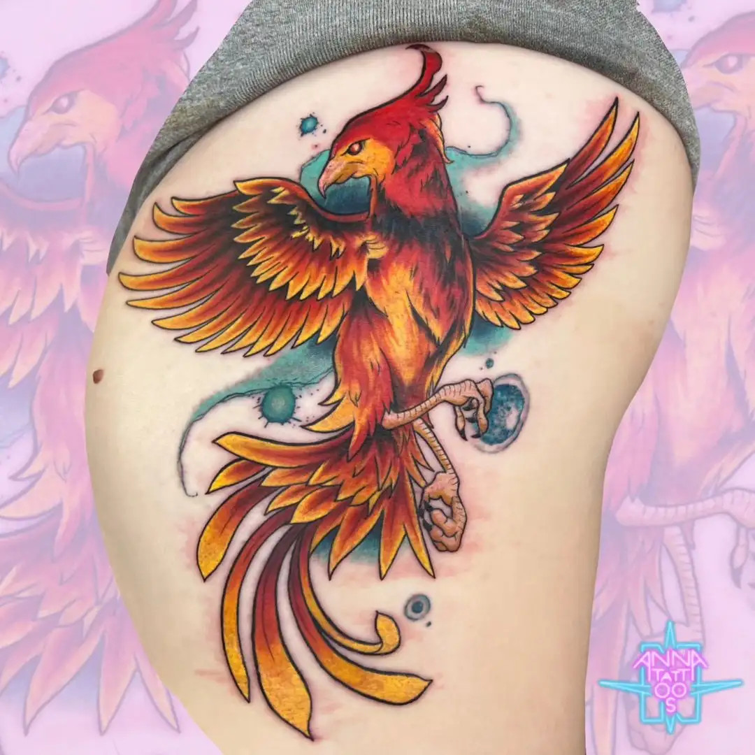 Vibrant phoenix tattoo on woman's rib cage symbolizing rebirth