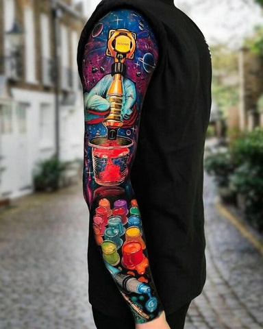 Color sleeve tattoo featuring a mix of vibrant colors and abstract shapes