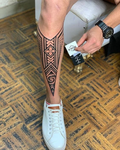 Creative and cool leg tattoo for men with a unique theme