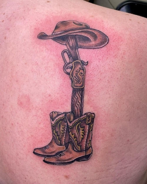 Cowboy hat and boots tattoo in simple black lines