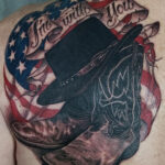 Black ink cowboy hat tattoo on forearm