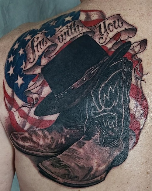 Black ink cowboy hat tattoo on forearm