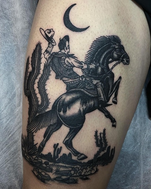 Cowboy riding a horse tattoo in silhouette style