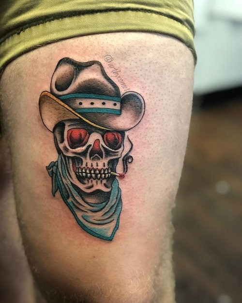 Cowboy skull tattoo with bandana and hat