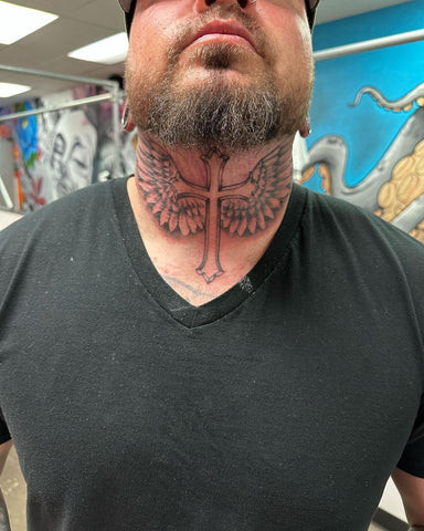 Geometric line cross tattoo on the back of a man's neck, modern and symmetrical design.