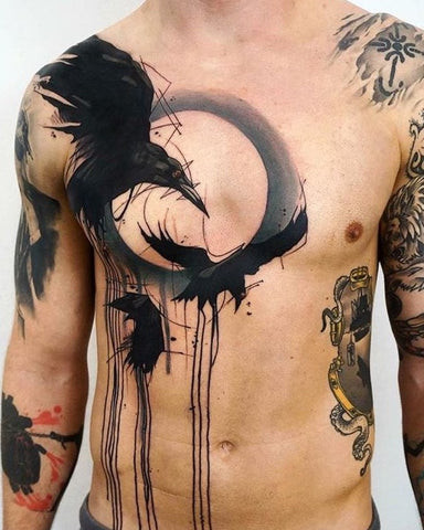 Crow chest tattoo with dark ink, symbolizing mystery, intelligence, and power.