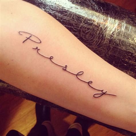 Intricate Cursive Tattoo Designs on Arm