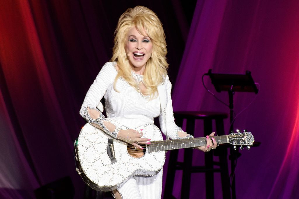 Dolly Parton performing tattoo display