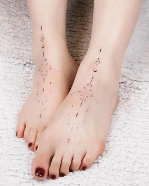 Matching dainty ornamental foot tattoos covering the feet with fine line designs, showcasing subtle and discreet artistry