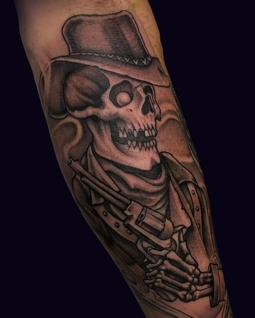 Dead cowboy tattoo smoking a cigarette in black and grey