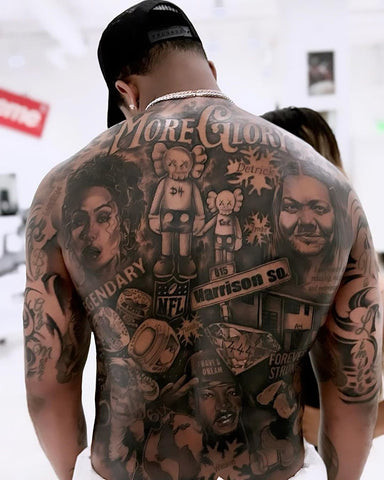 Deshaun Watson's full back tattoo featuring diverse elements like family, artwork, and sports symbols, reflecting his life and inspirations.