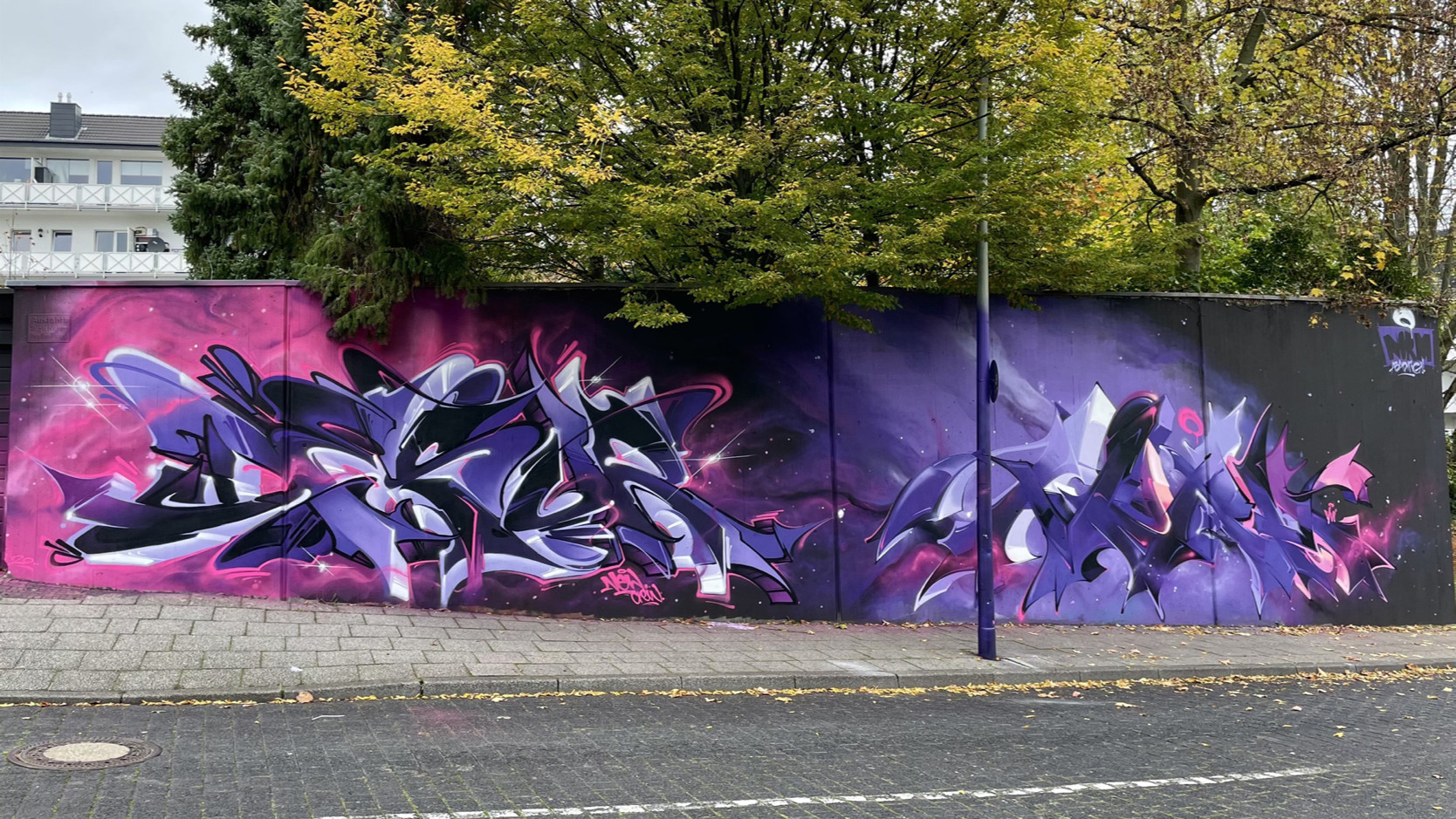 A collaborative graffiti piece by Desur and Norm, showcasing their combined styles and techniques.