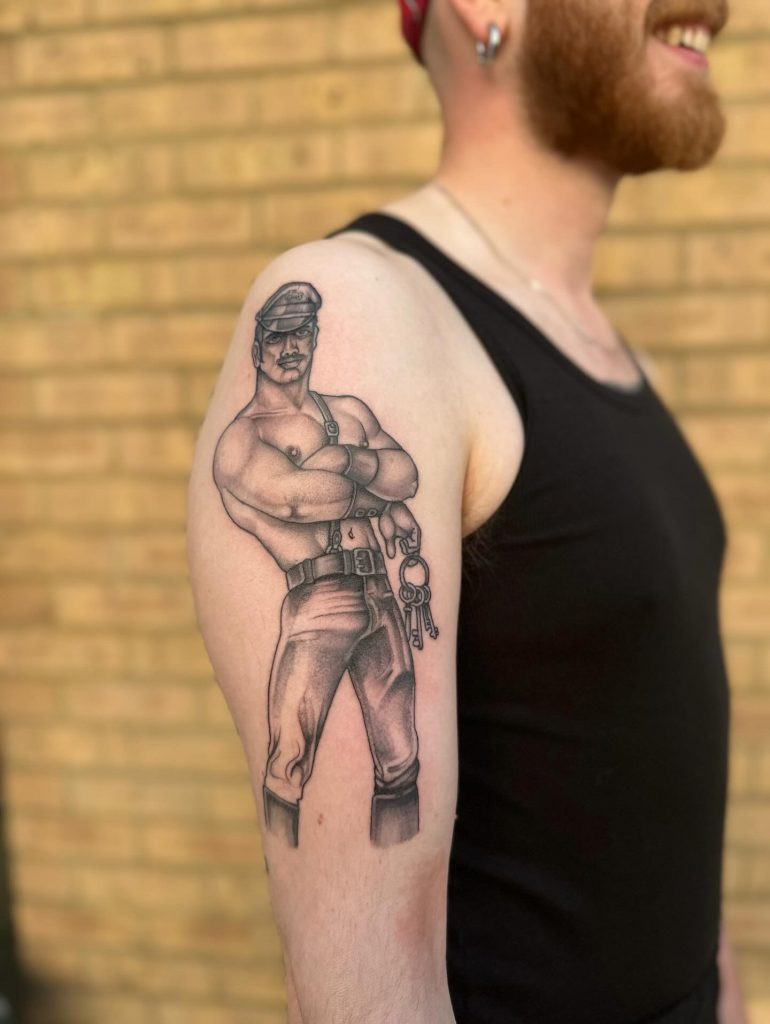 Dexter Kay (@dexterkay) in their tattoo studio, dedicated to providing a comfortable and inclusive environment for queer clients seeking BDSM tattoos.