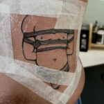 Tattoo wrapped in cling film by Dexter Kay