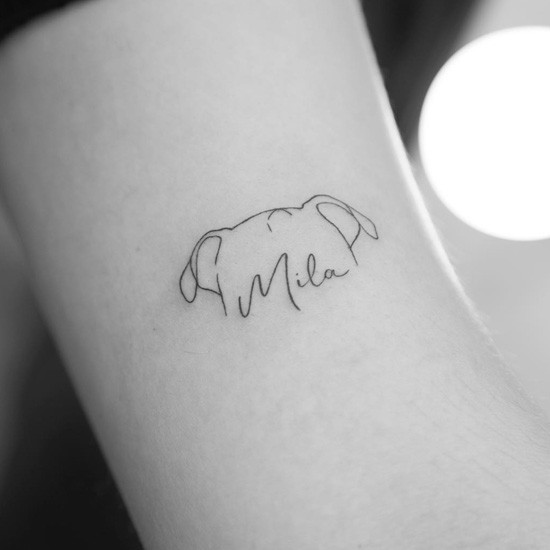 Dog ear outline tattoo with name