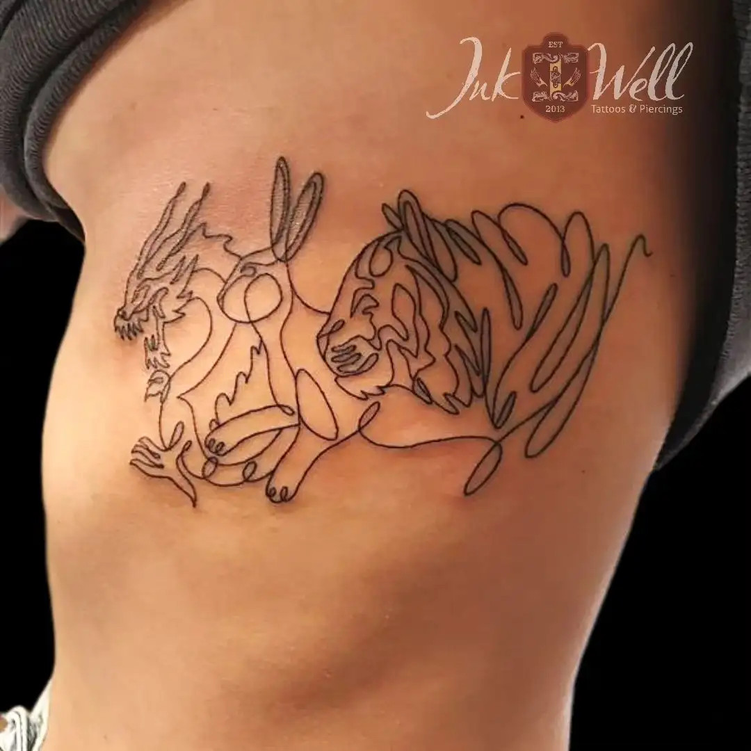 Whimsical doodle style side rib tattoo for women