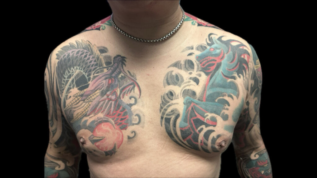 Bold chest tattoo showcasing Asian-inspired art, clearly visible from a distance, demonstrating excellent tattoo readability for body art.