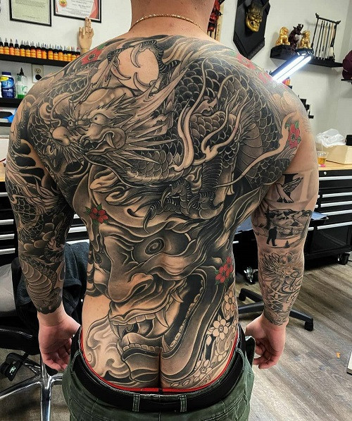 Large scale dragon tattoo covering entire back