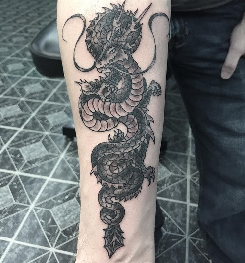 Dragon tattoo on the inner forearm area