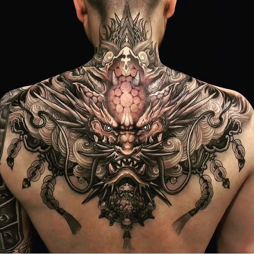 Detailed dragon head tattoo with fierce expression