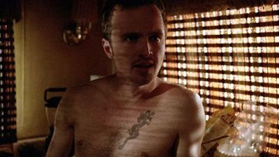 Jesse Pinkman with dragon and skull chest tattoos