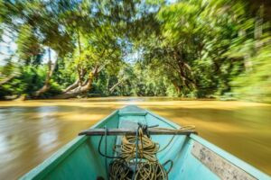 Traveling by boat to Entalau up the Skrang River, the heart of Iban culture in Borneo.