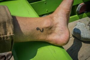 A final view of the author's Iban fish hook tattoo, a permanent reminder of a profound cultural experience.