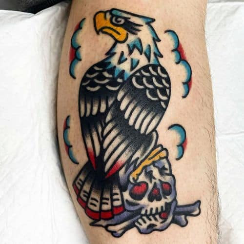 Stylized eagle tattoo on the arm, representing freedom in men tattoo ideas.