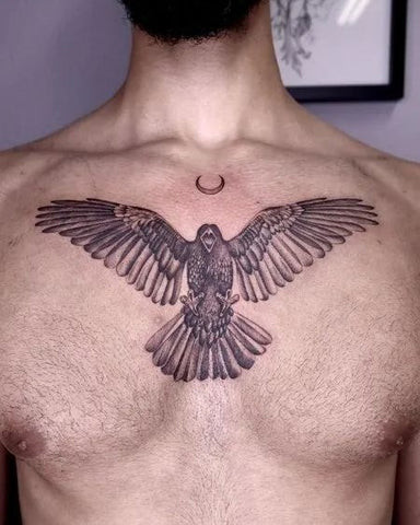 An eagle chest tattoo with detailed feathers and a powerful gaze, symbolizing freedom and strength.