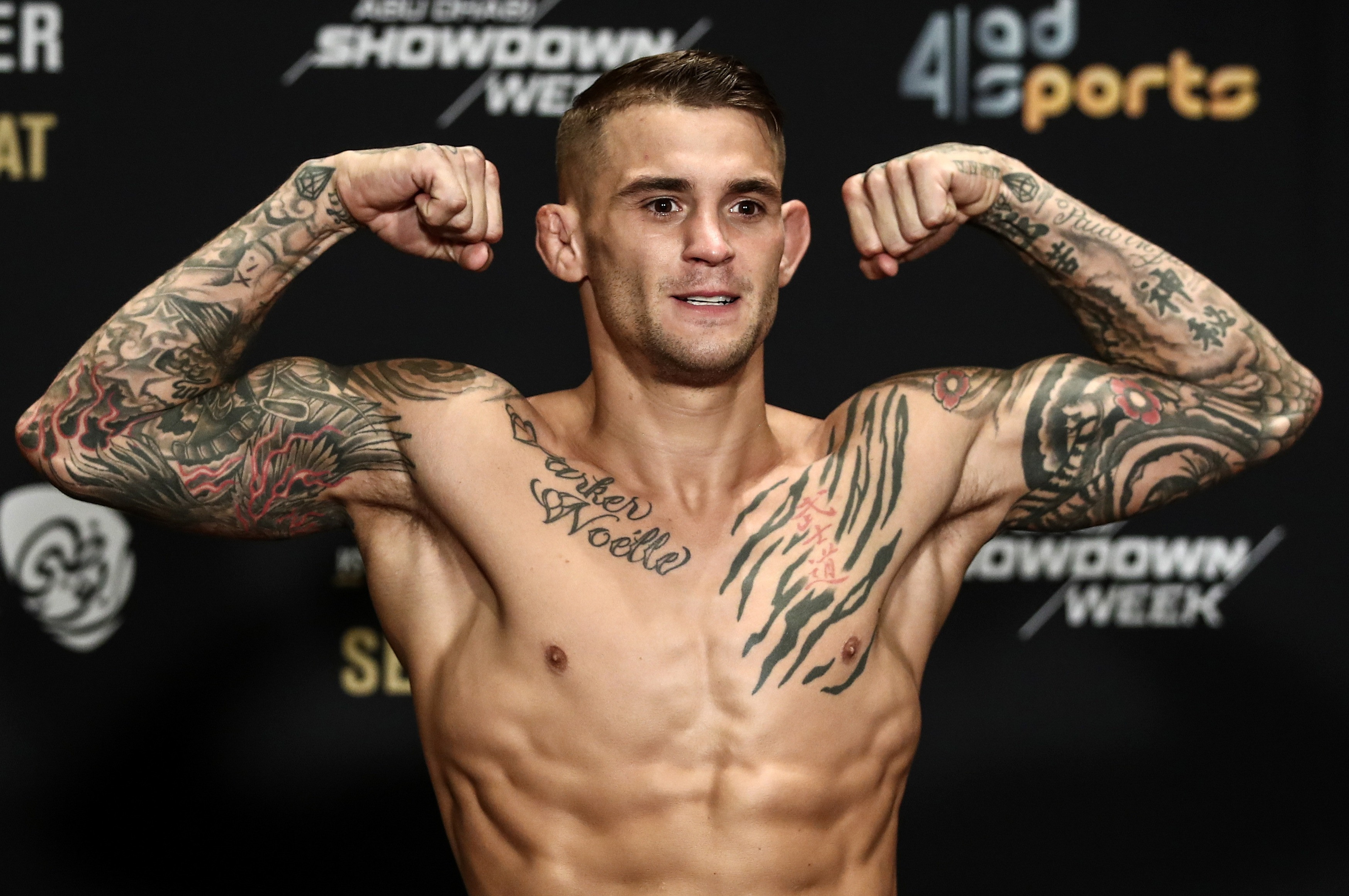 Dustin Poirier showcasing his extensive tattoo collection